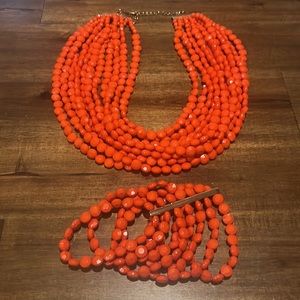 Orange needed necklace and bracelet set. EUC. Boutique.